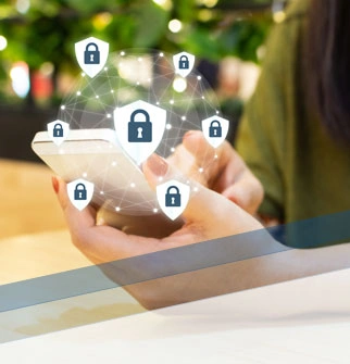 Hand holding cell phone with symbols of digital security