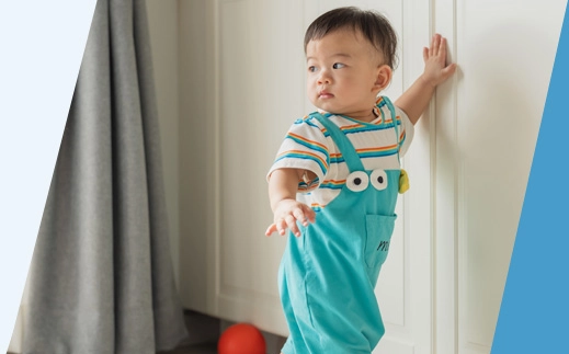 Asian baby in home kitchen